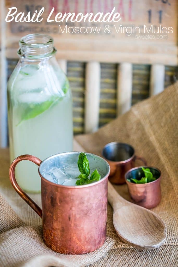 copper cups with lemonade and basil in them
