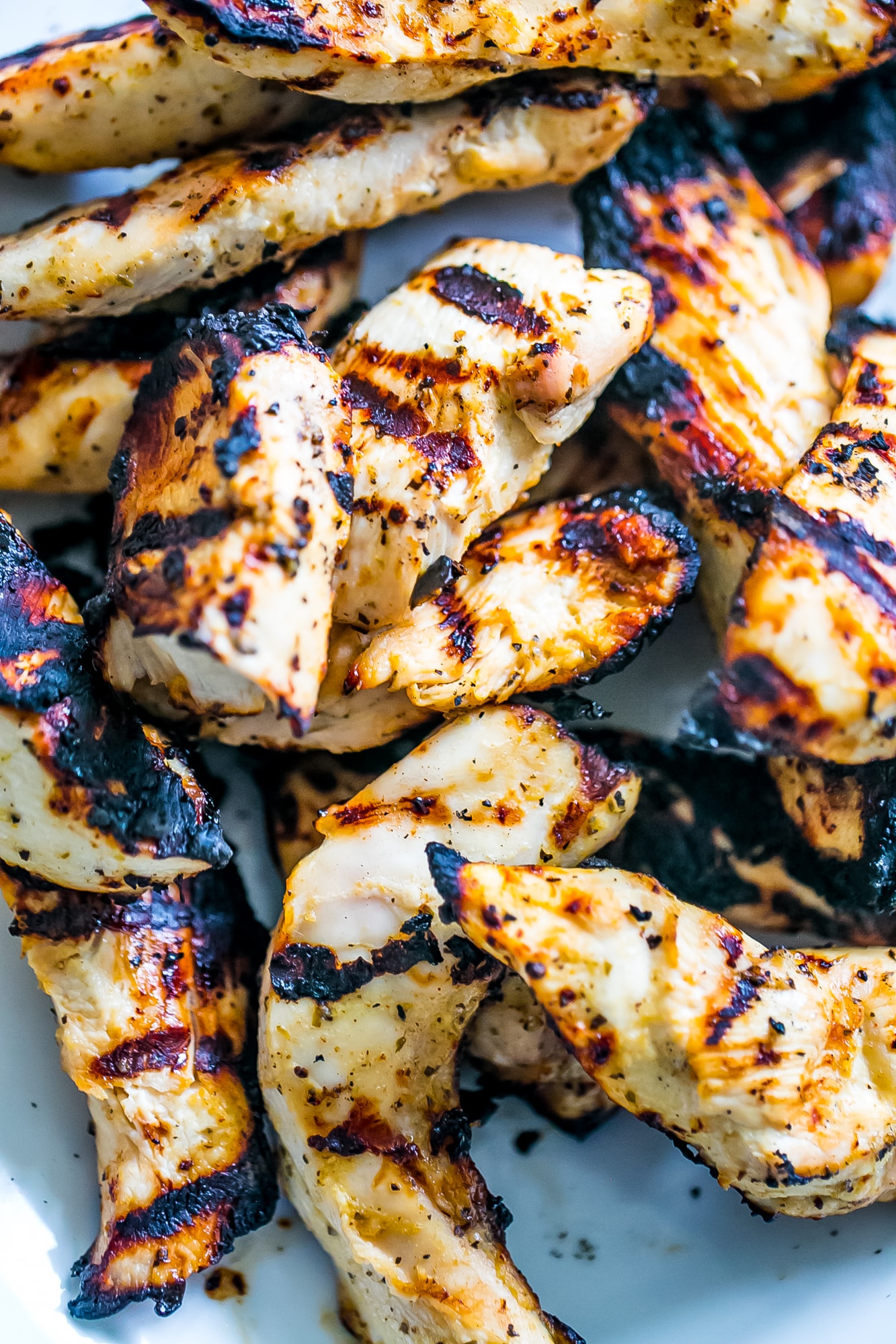 picture of grilled chicken strips up close. 