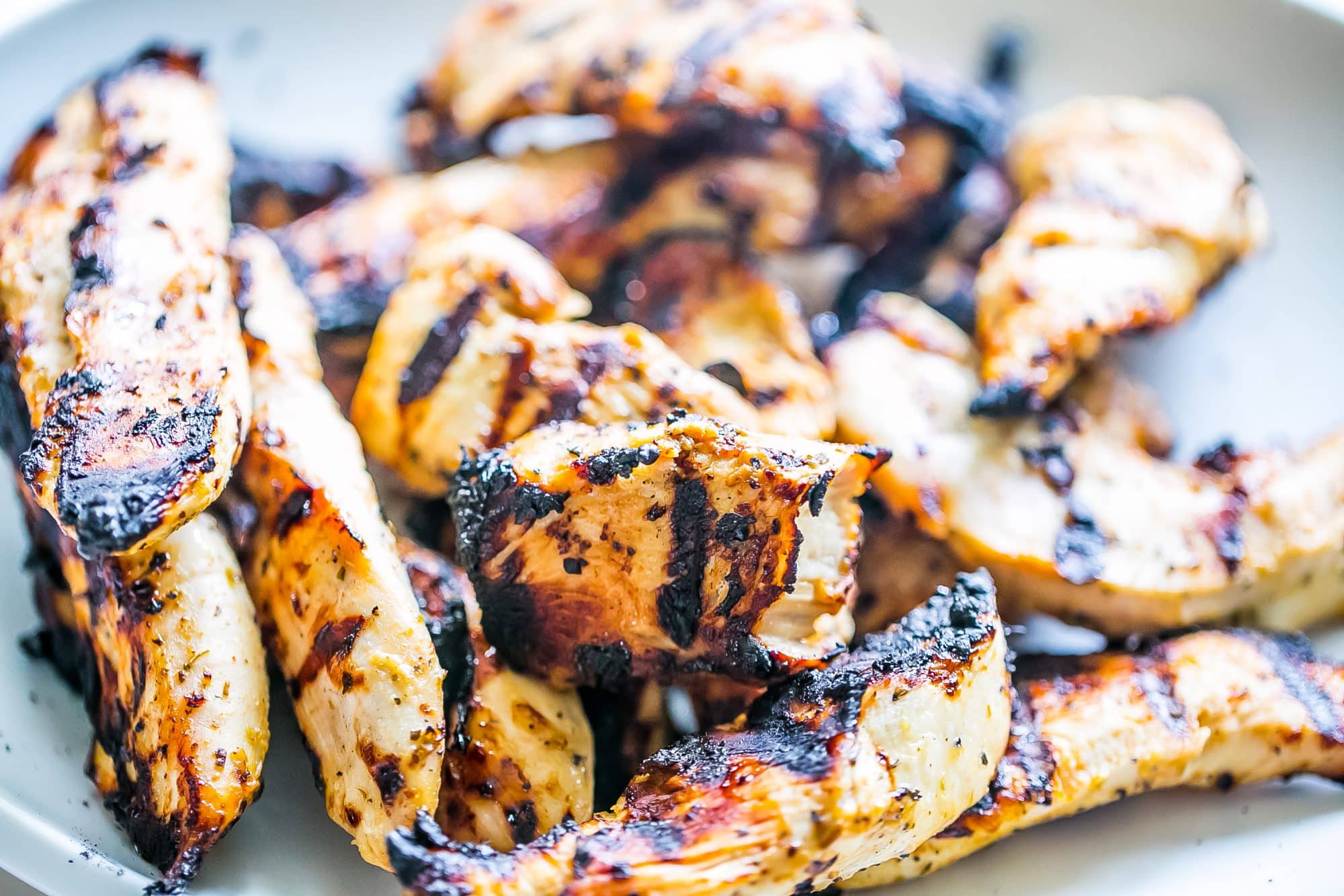 picture of grilled chicken strips up close.