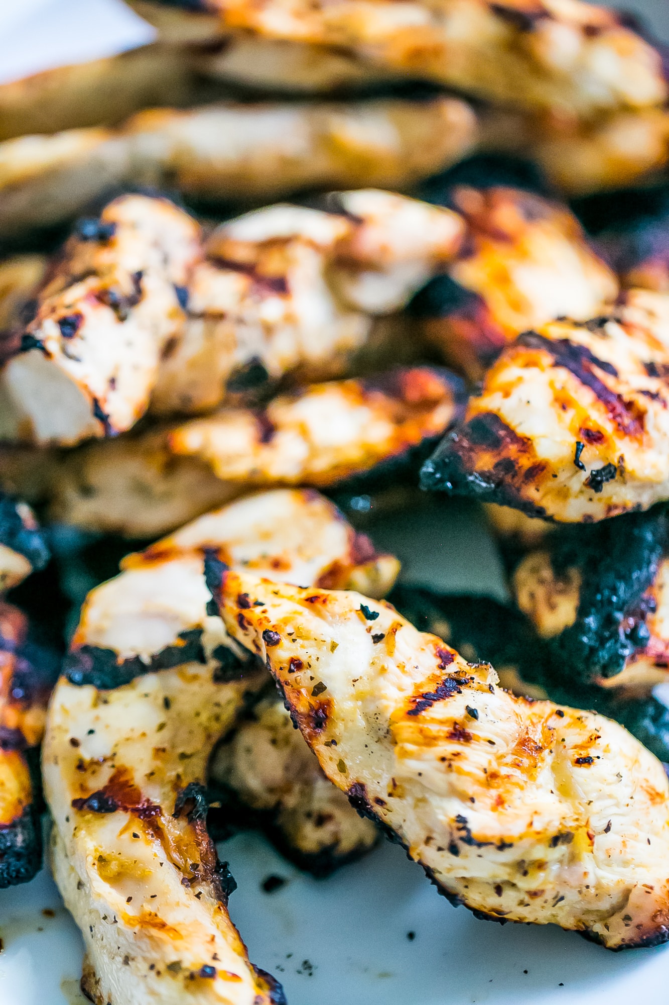 picture of grilled chicken strips up close.