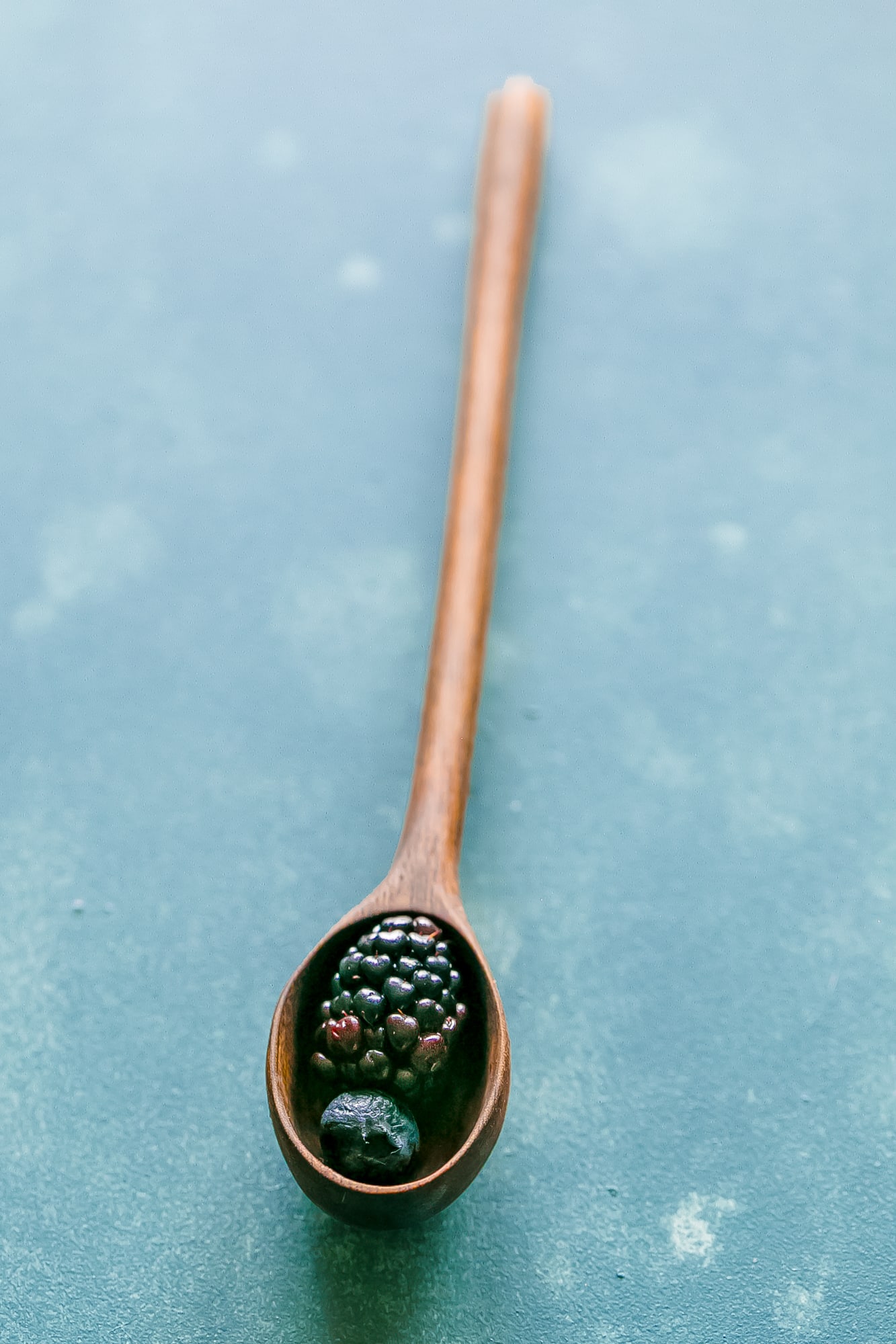 berries in a wood spoon