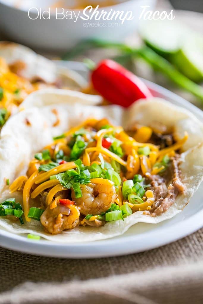 tacos with shrimp, cheese, chives, and refried beans