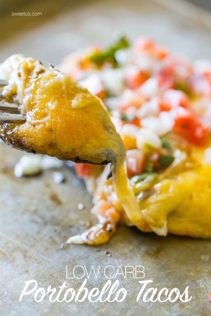 mushrooms caps with Pico and cheese on them being moved with the fork