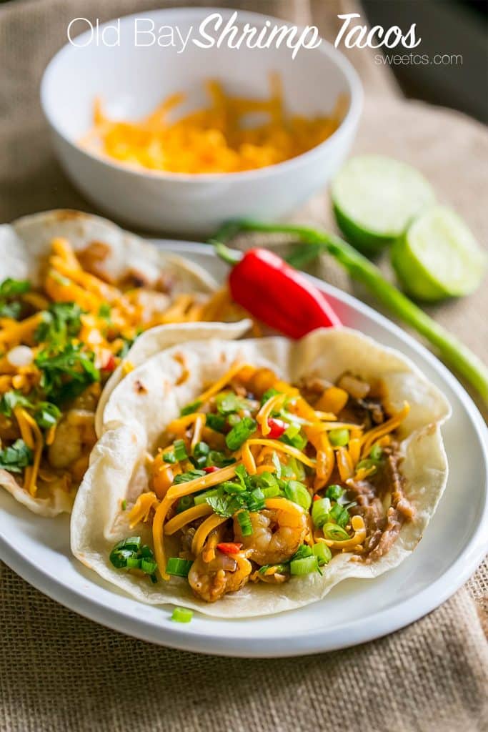 tacos with shrimp, cheese, chives, and refried beans