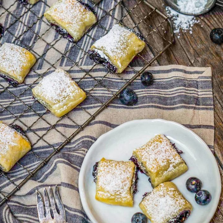 Blueberry pastries with powdered sugar.