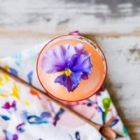 A sparkling punch with a pansy flower garnish.