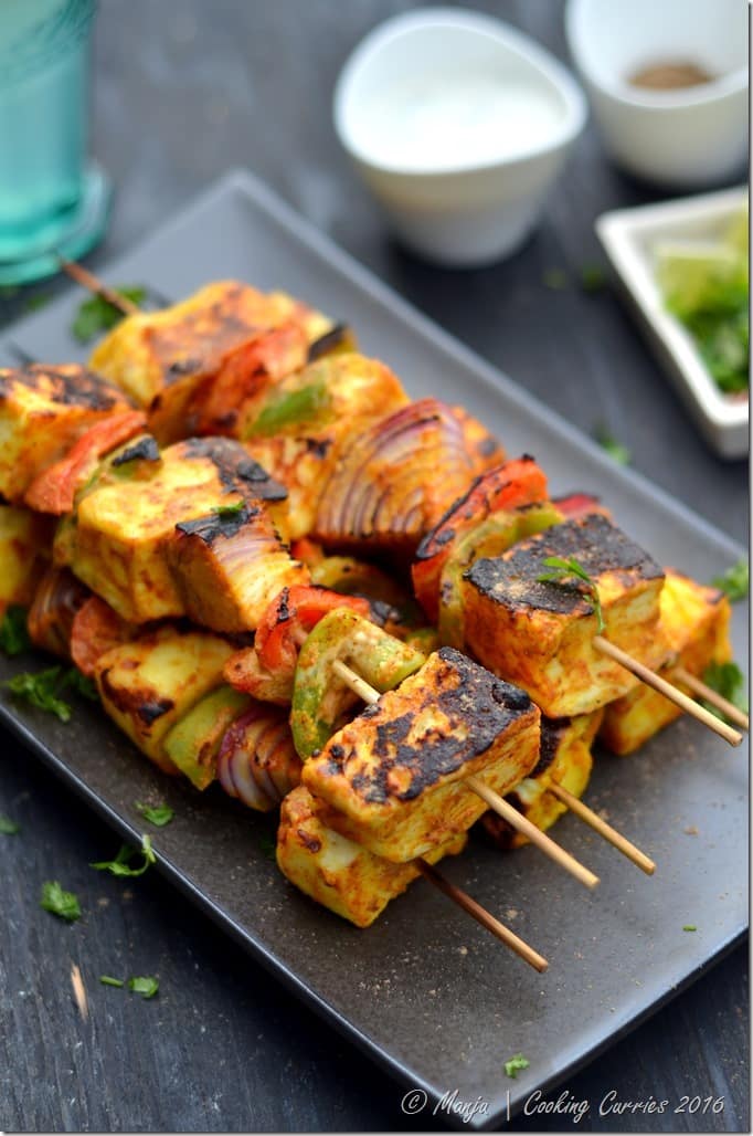 grilled paneer cheese with vegetables on skewers