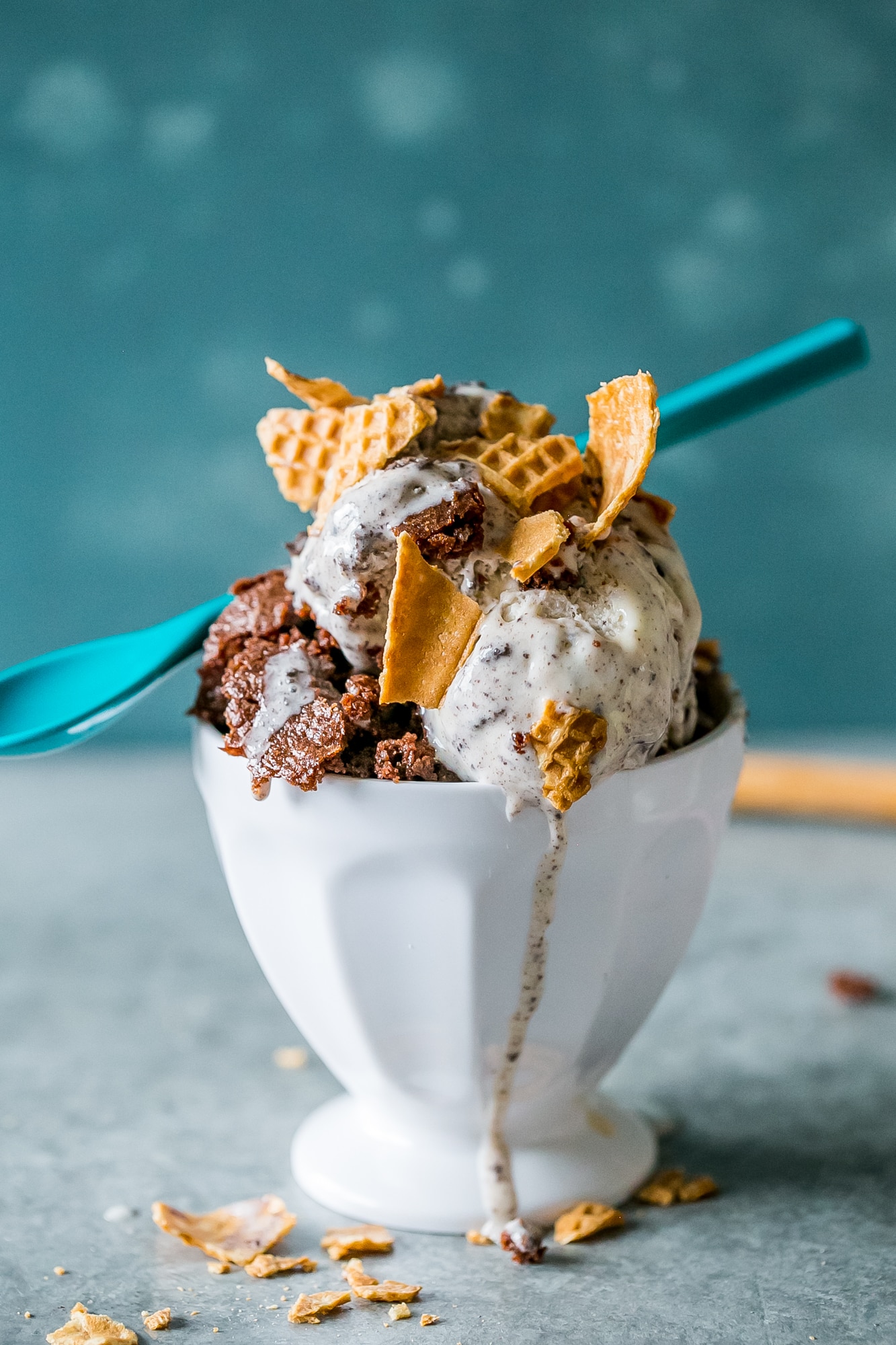 a bowl topped with waffle cones and ice cream and brownies