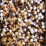 A pan full of s'mores and graham cracker rice krispie treats.