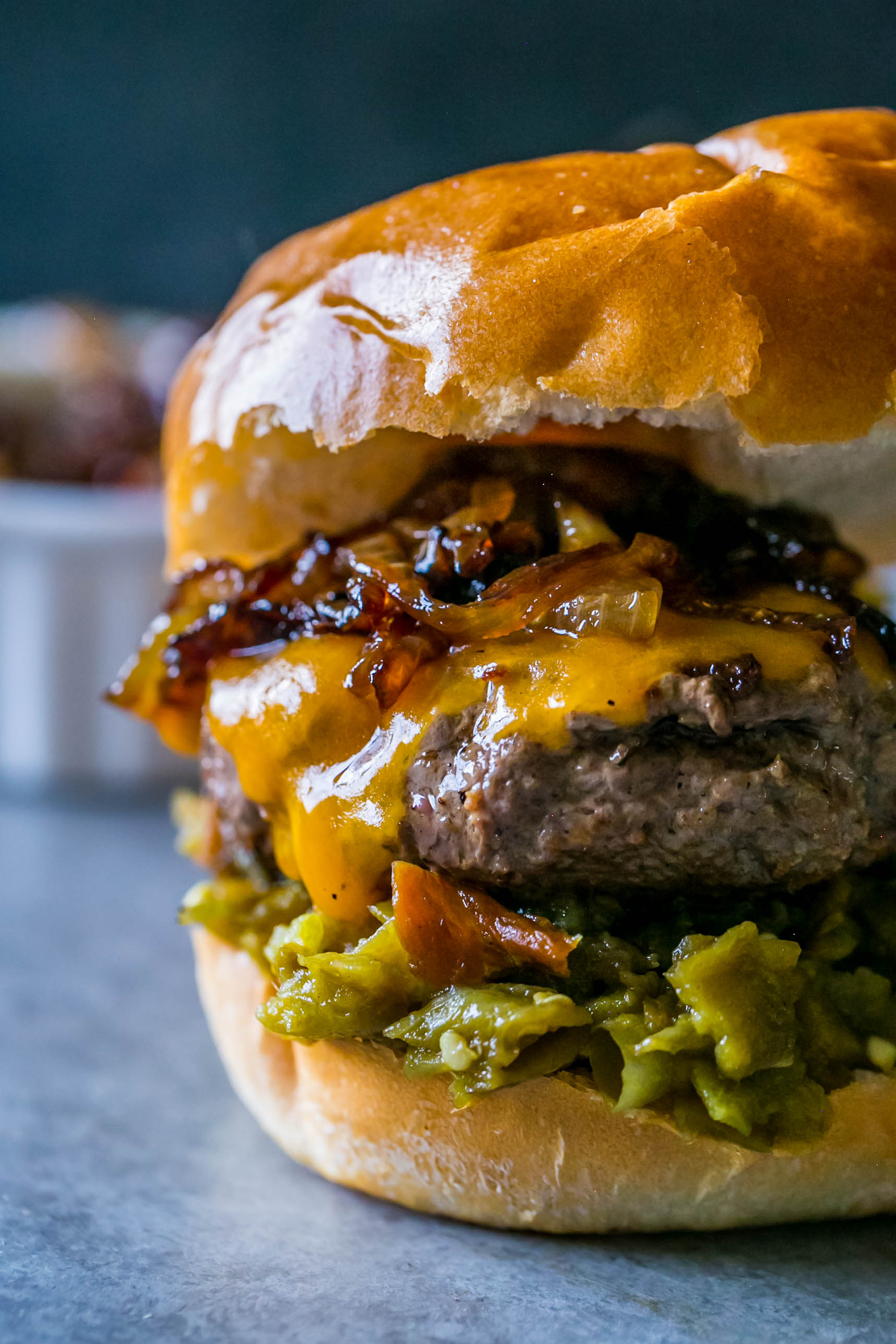 These are the most delicious burgers ever with green chili and whiskey onions! No grill needed - cook on the stove! 