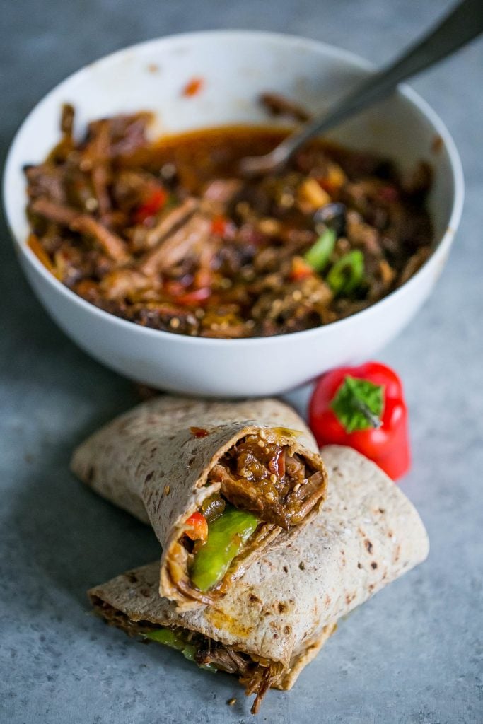 shredded pork with green bell pepper in a tortilla