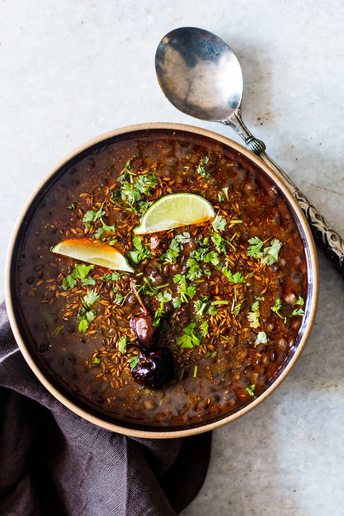 black lentil soup with cilantro and lime