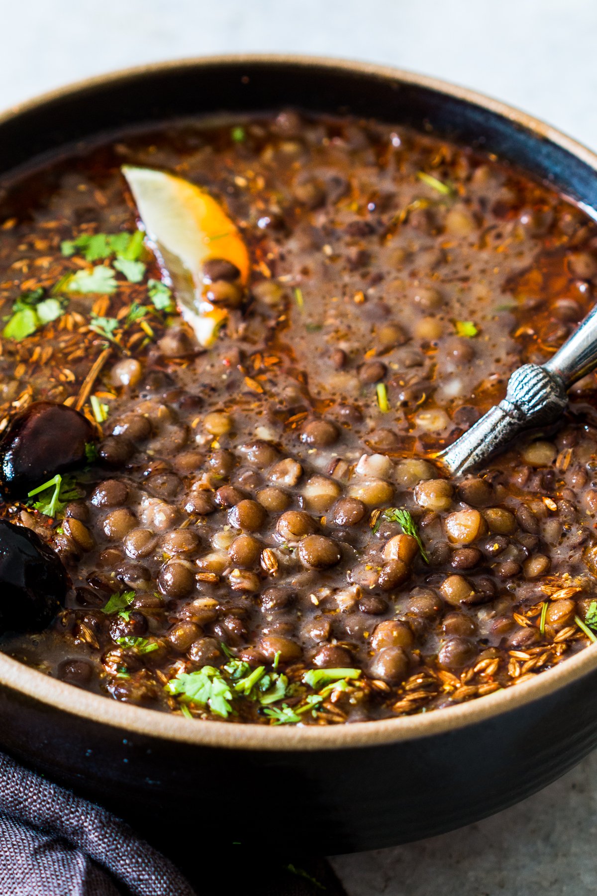 black lentil soup with cilantro and lime