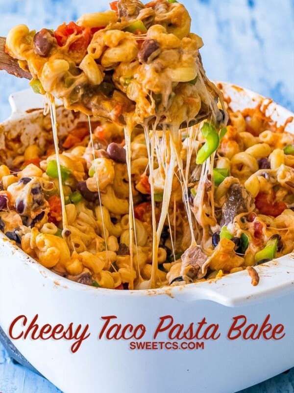 Cheesy taco pasta bake in a white dish.