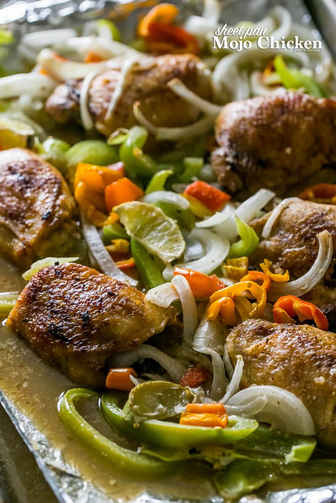 chicken, peppers, onions, and bell peppers on a sheet pan