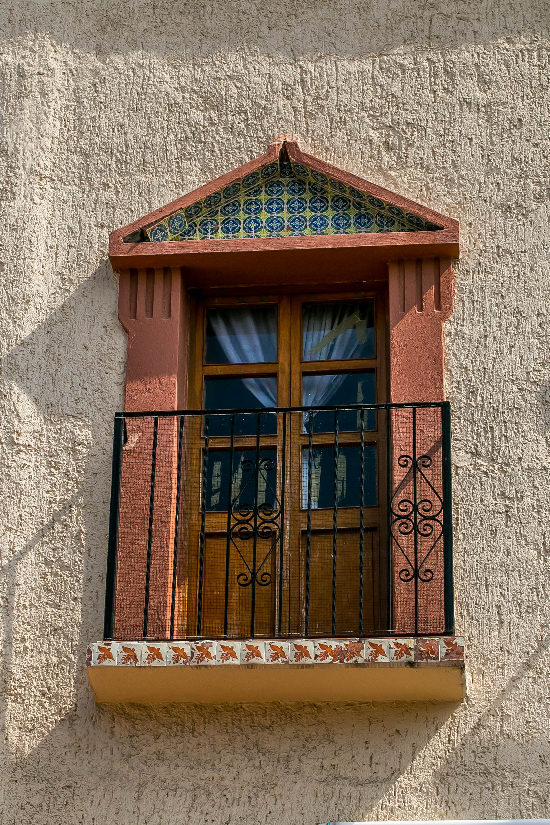 a gallery door with cast iron handrail