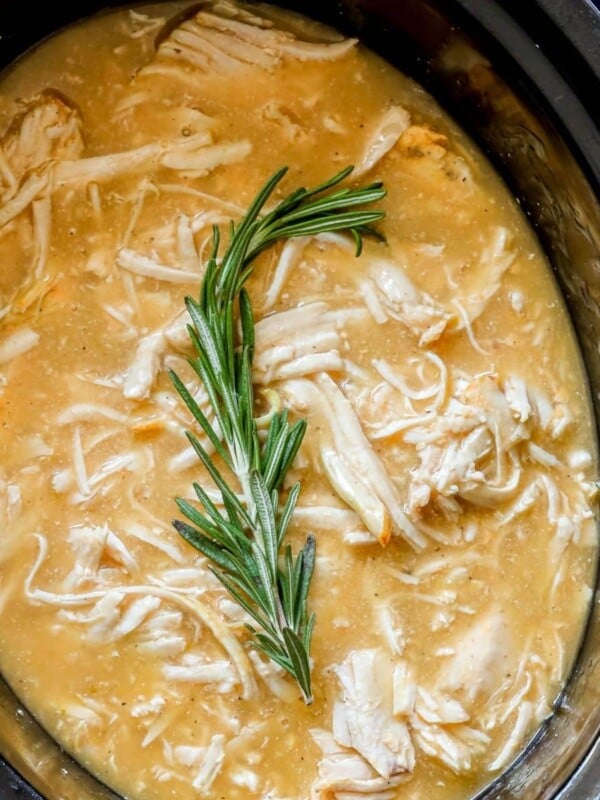 picture of shredded turkey in gravy in a slow cooker