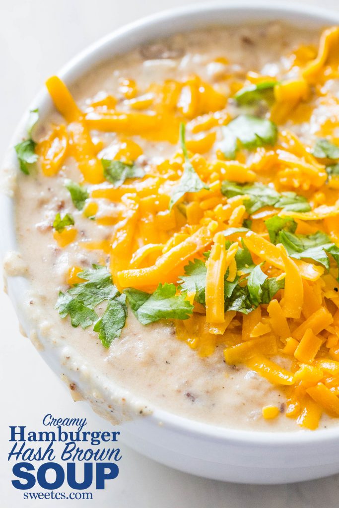 creamy soup with cilantro and cheese melted on it