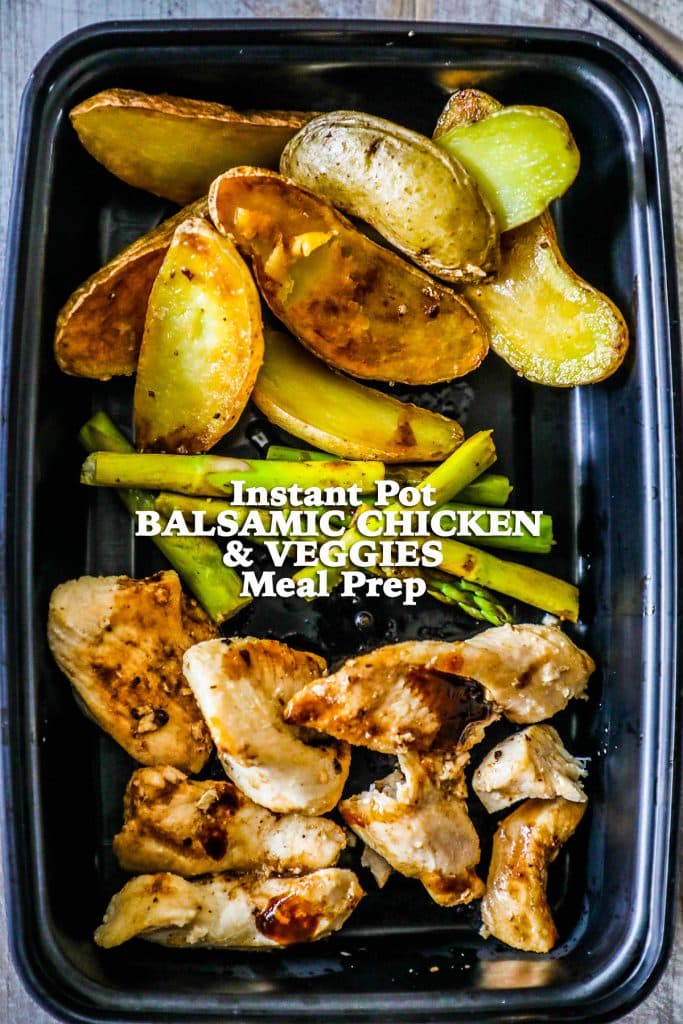 plastic container with roasted potatoes, asparagus, and cooked chicken in it