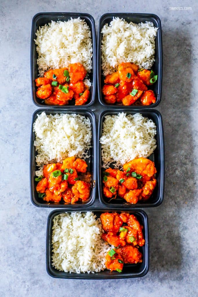 to do containers with rice and chicken with orange sauce and chives in it