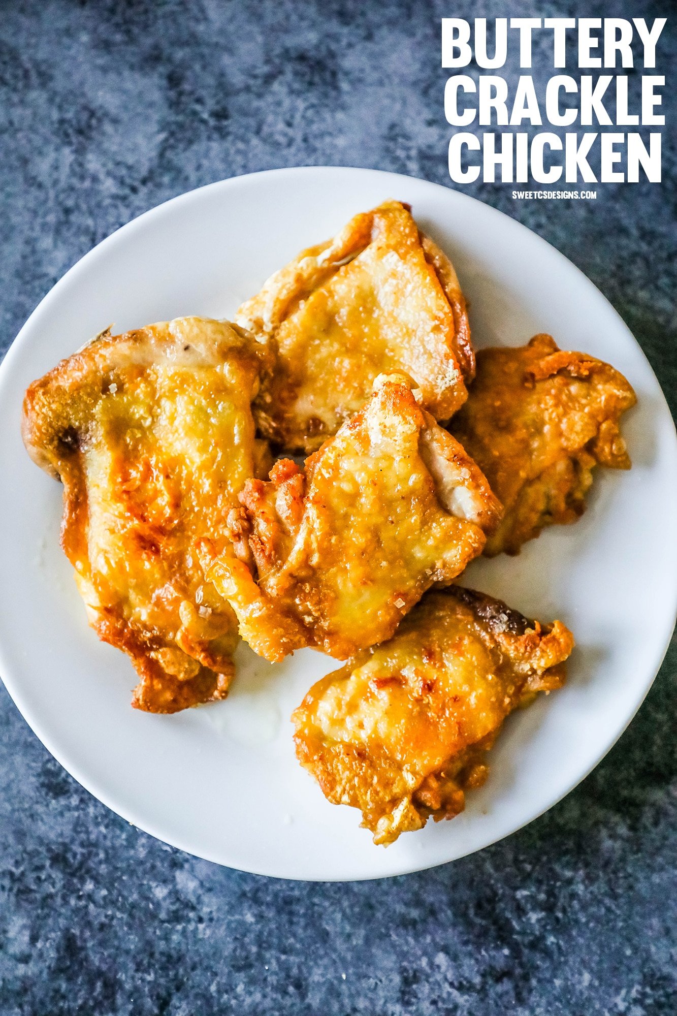 crunchy keto fried chicken thighs on a white plate