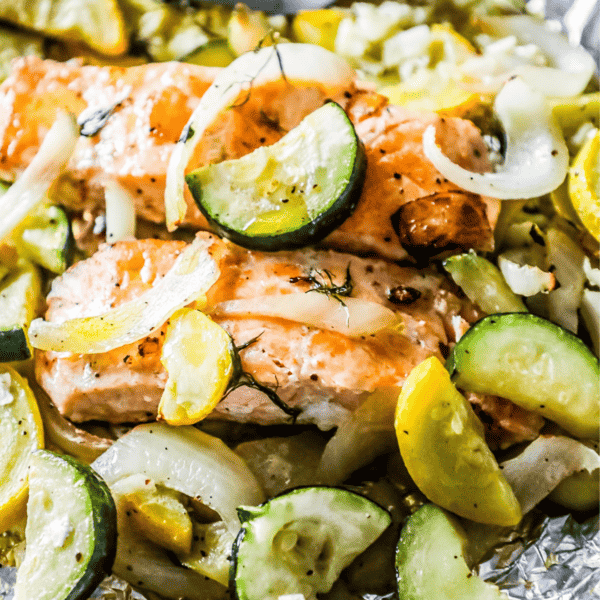 Garlic Herb Salmon and Zucchini grilled in foil with onions.