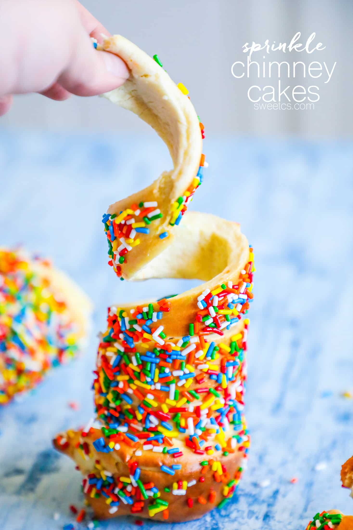 cake in a sphere with sprinkles on it 