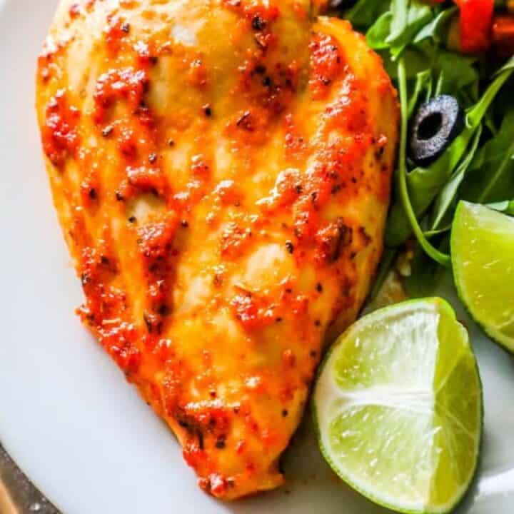Oven-roasted chicken breasts with a pimento-infused salad.