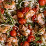 Indulge in a delicious Tuscan shrimp linguine dish with tomatoes.