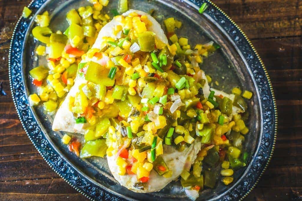 chicken topped with pineapple, pepper, corn, and green onions