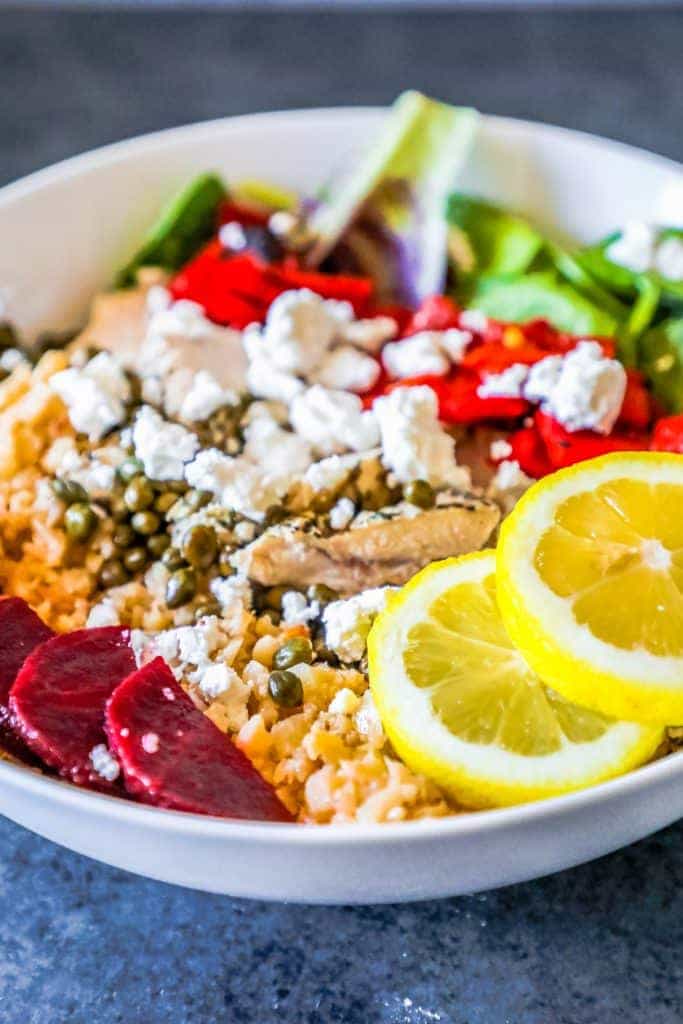 cauliflower rice with chicken, feta, red peppers, beets and lemons