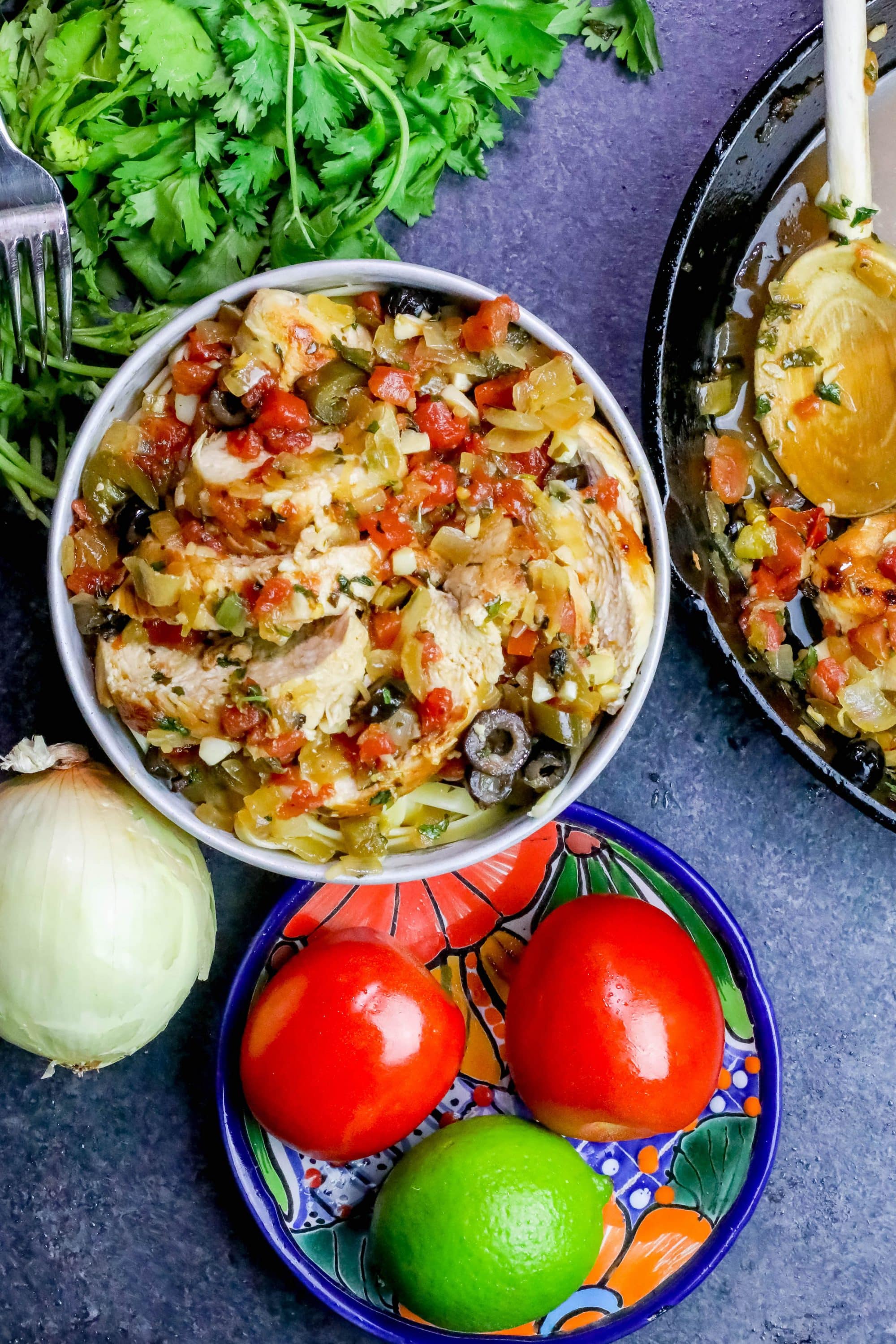 chicken on pasta with vegetables on it