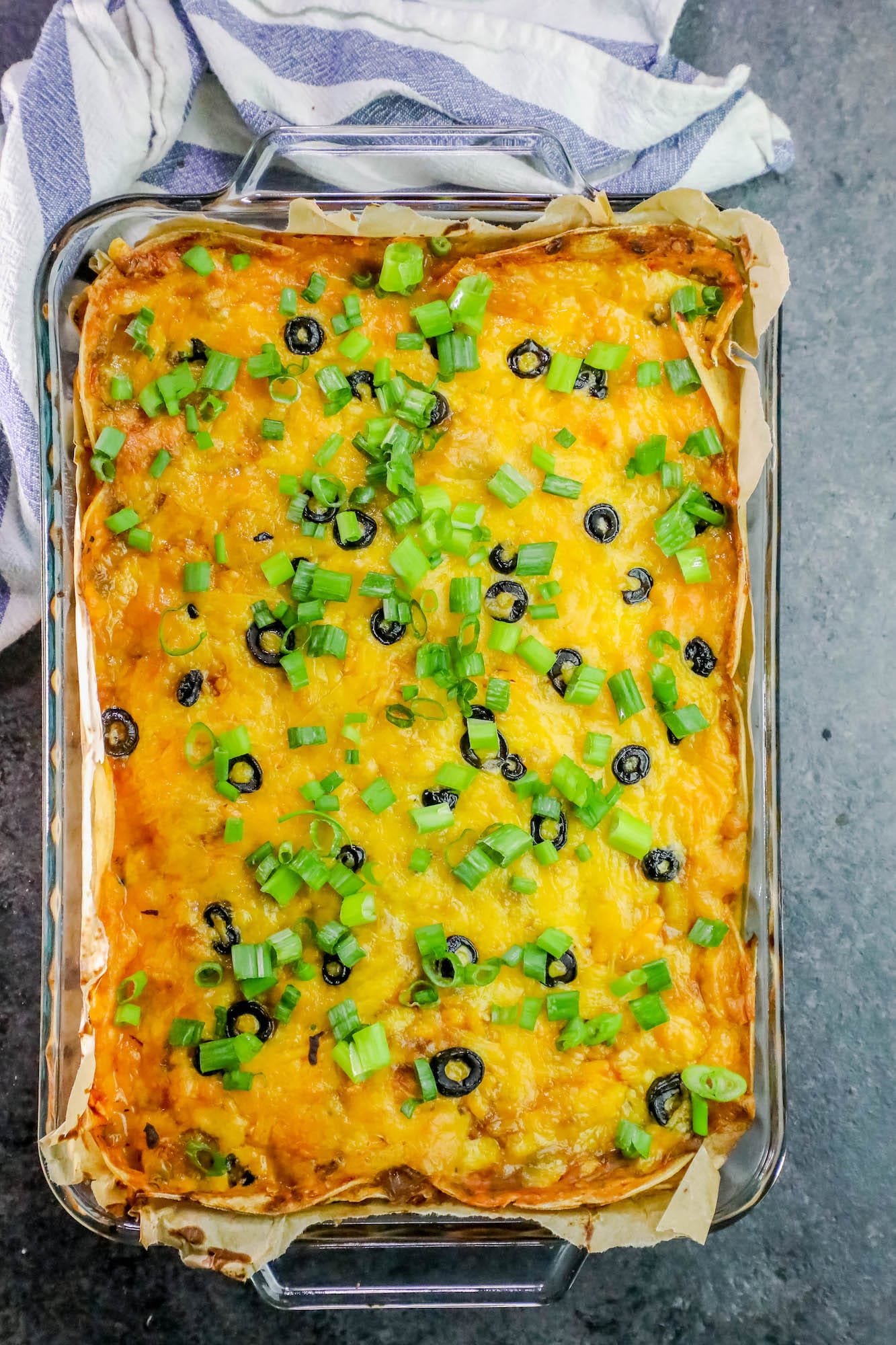 casserole with cheese, olives, and green onions