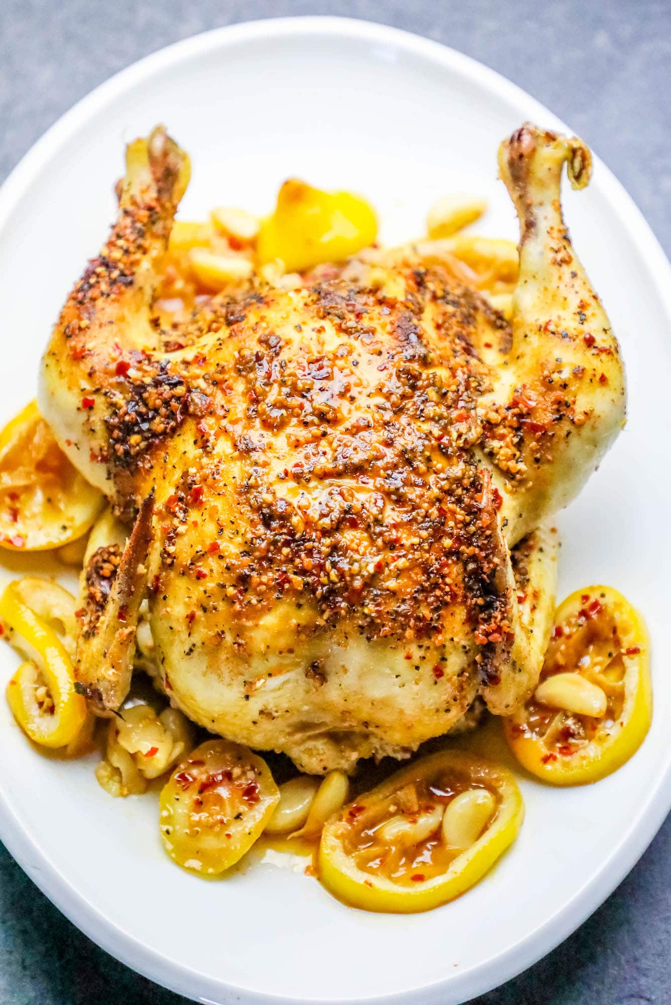 whole chicken covered in herbs roasted with lemons and garlic as the base