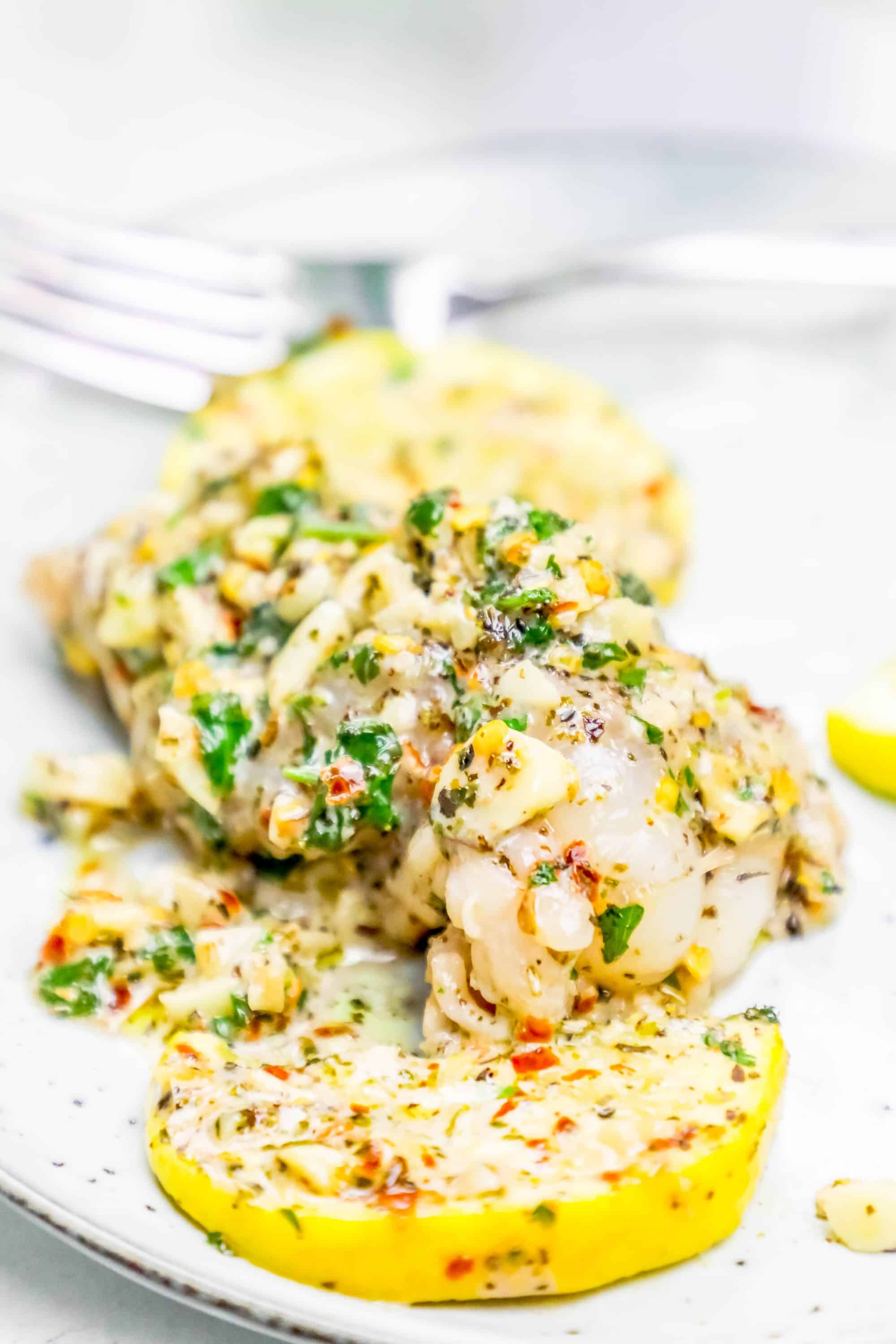 chicken with lemony, garlic, spices on it