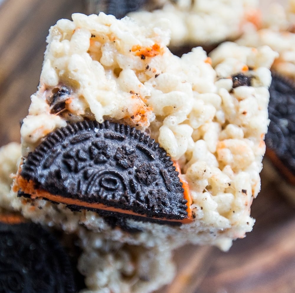 Halloween-themed Oreo Krispie Treats on a cutting board.