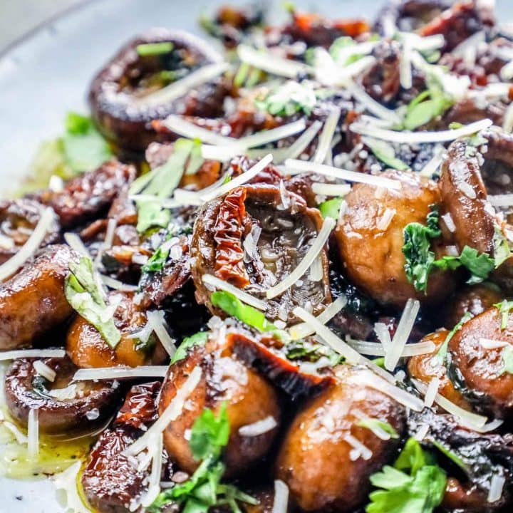 Garlic Butter Parmesan Tuscan Mushrooms served as a low carb side dish with parsley.