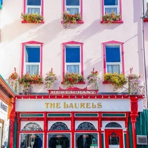 A colorful building with a sign that says 'the barrel's', a must-visit in Killarney, Ireland.