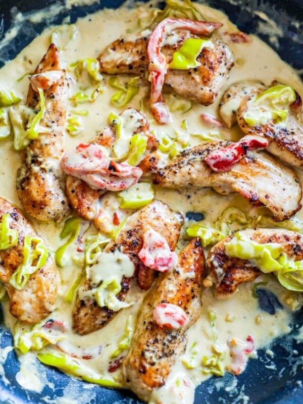 chicken in a white sauce with peppers and pepperoncini