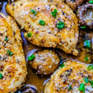 Chicken breasts in a creamy garlic sauce with mushrooms and olives.