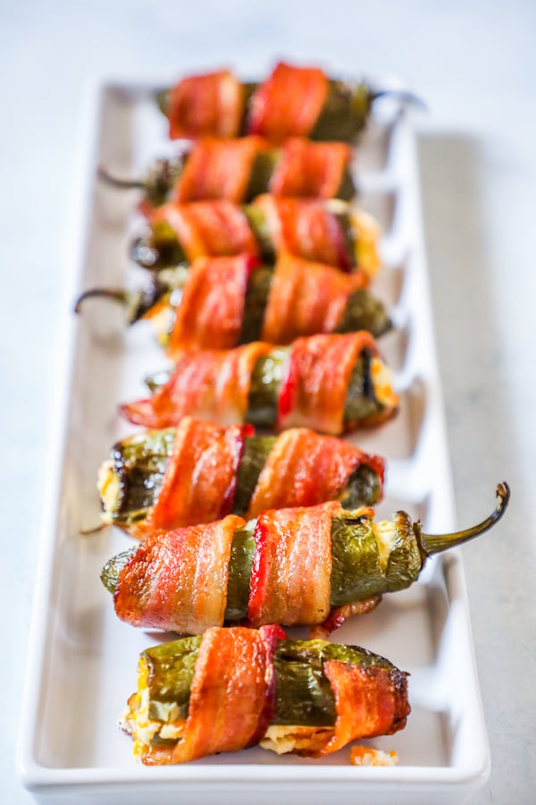 picture of bacon wrapped jalapeno poppers on a plate