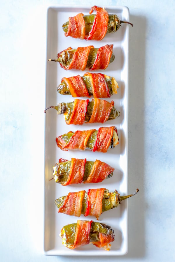 picture of bacon wrapped jalapeno poppers on a plate