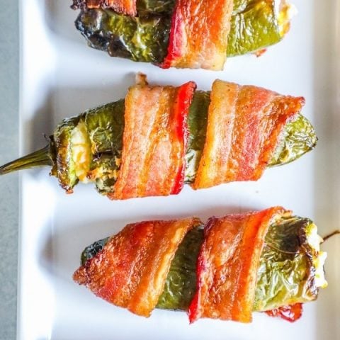 picture of bacon wrapped jalapeno poppers on a plate