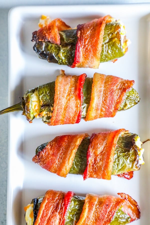 picture of bacon wrapped jalapeno poppers on a plate