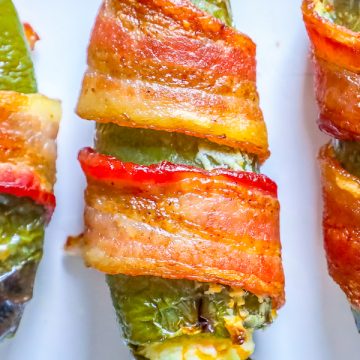 picture of bacon wrapped jalapeno poppers on a plate