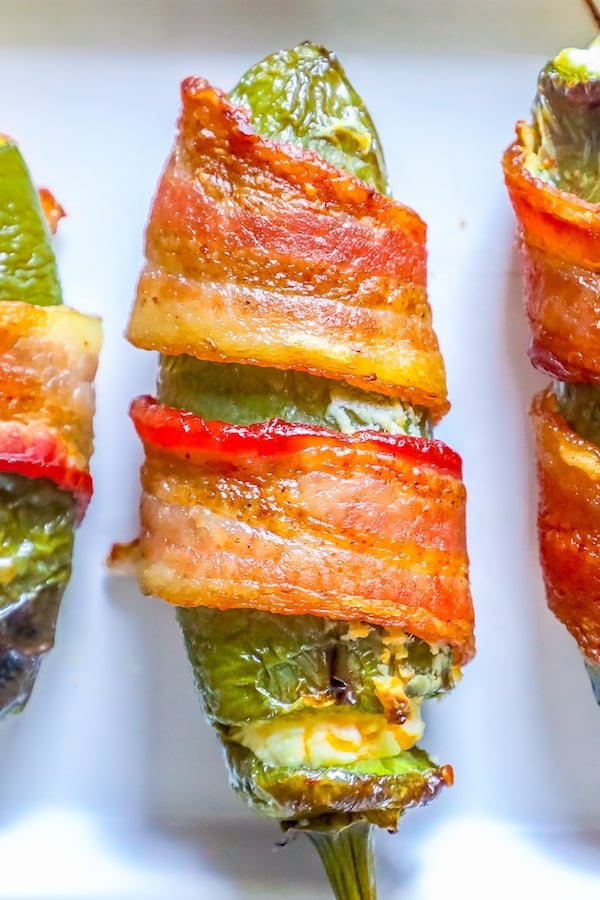 picture of bacon wrapped jalapeno poppers on a plate