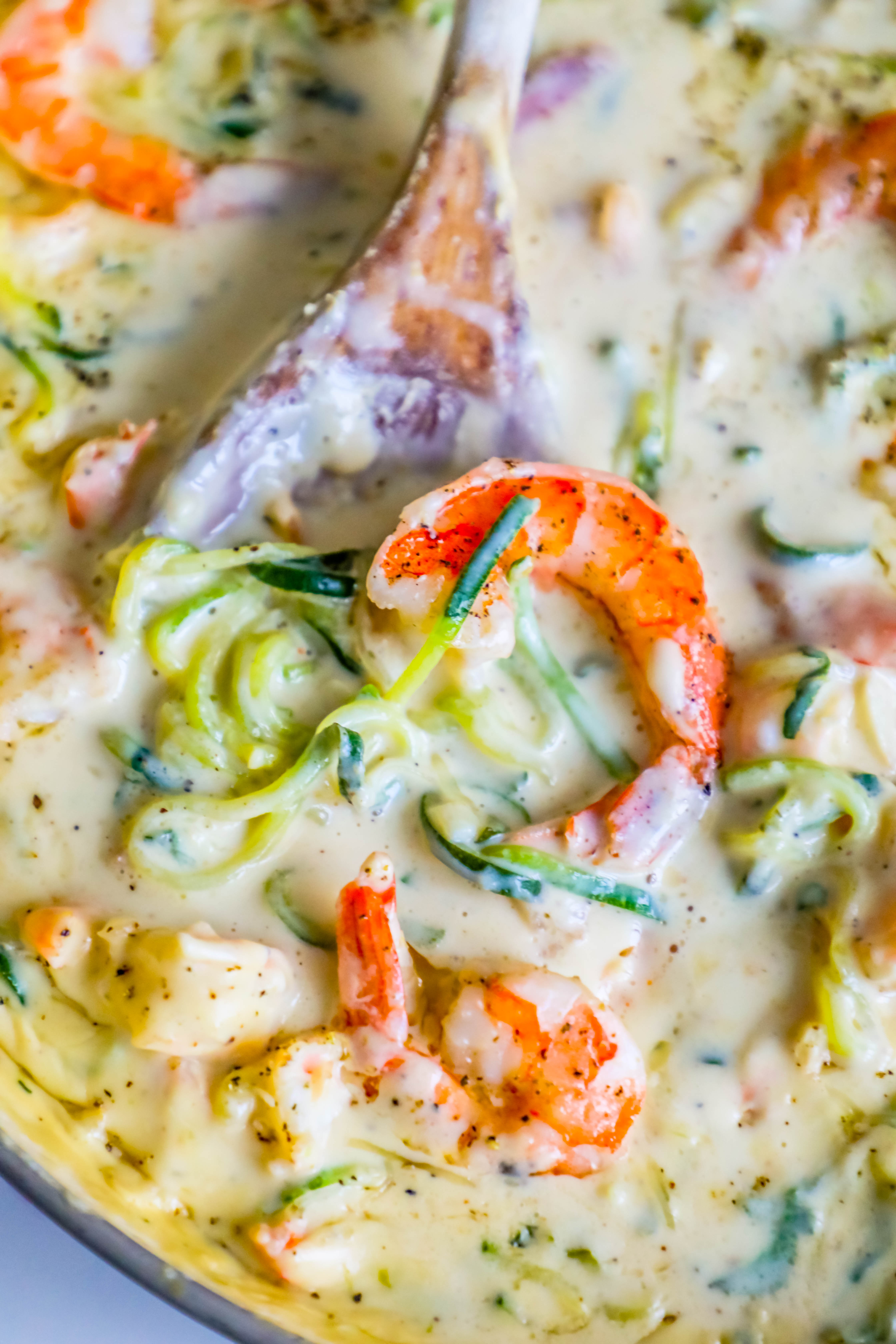 shrimp in a creamy sauce with noodles made out of zucchini