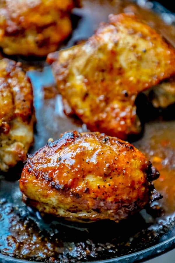 spicy crispy chicken thighs with a brown sauce.