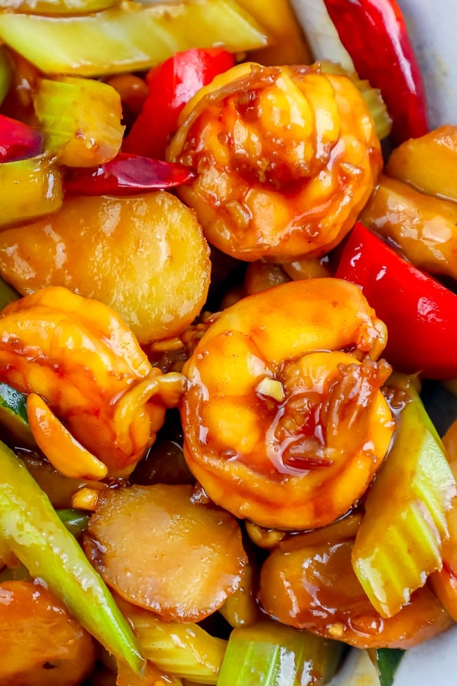 closeup picture of shrimp in kung pao sauce with vegetables