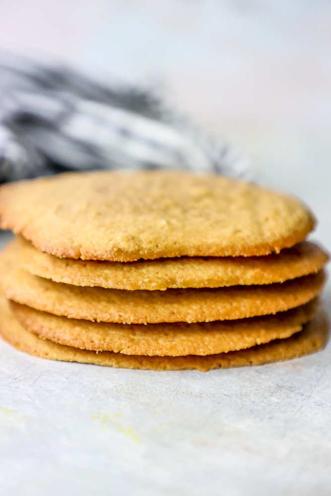 stack of peanut butter cookies with a bite out of it stacked.